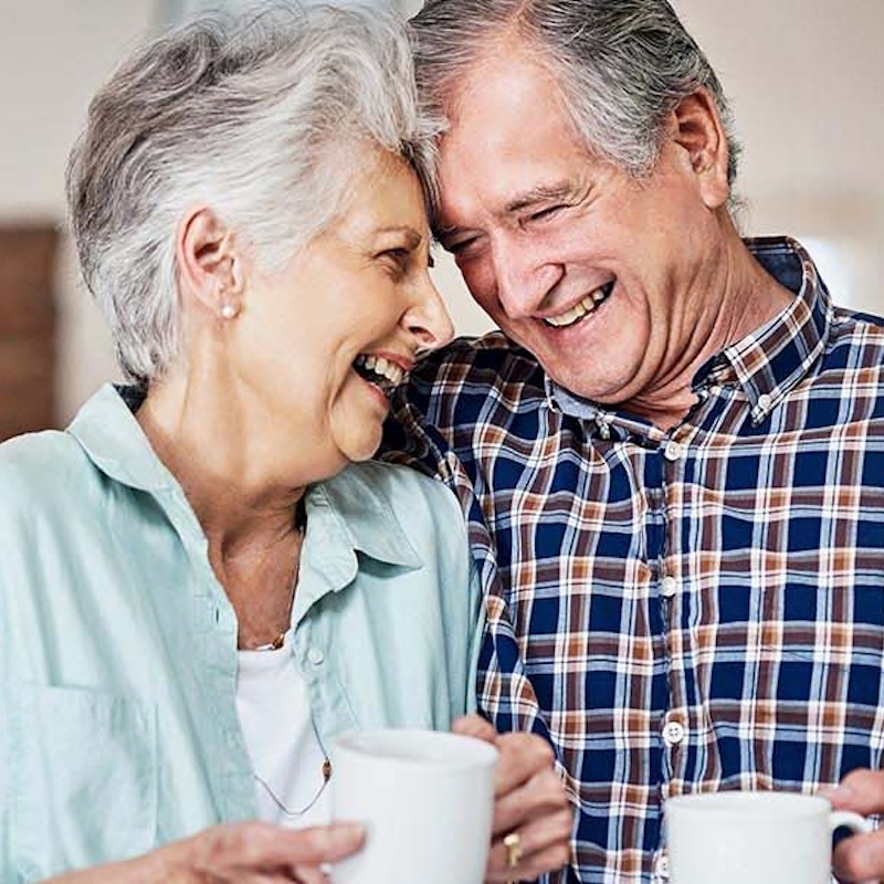 elderly couple drinking coffee