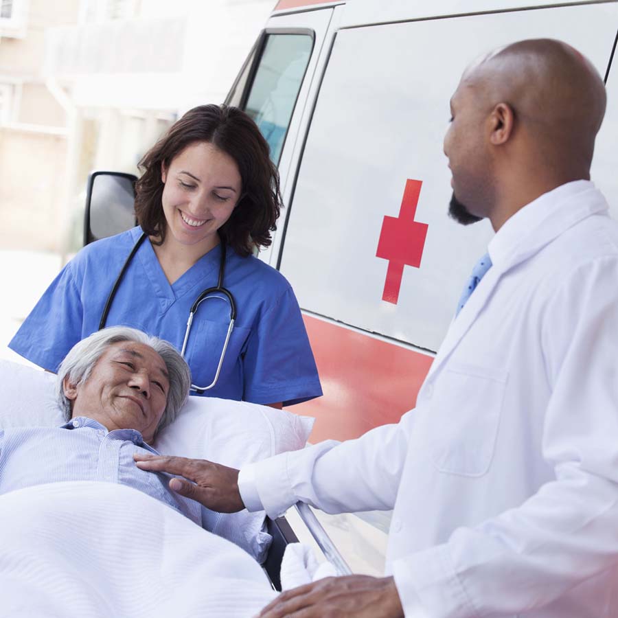 a guy getting off an ambulance on a stretcher